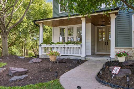 27125 Marsh Point Ct front porch with bead board ceiling, new lighting and window boxes .