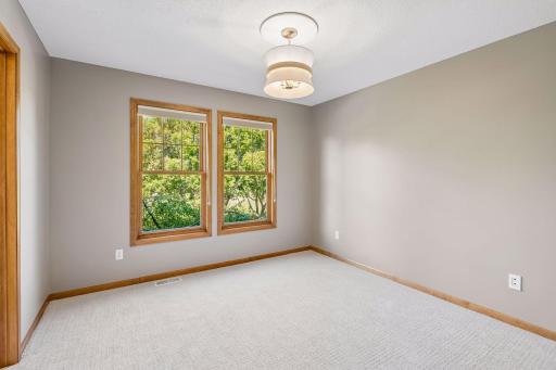 Bedroom #4 of 4 on upper level. New carpet and lighting. Walk-in closet and private bath.