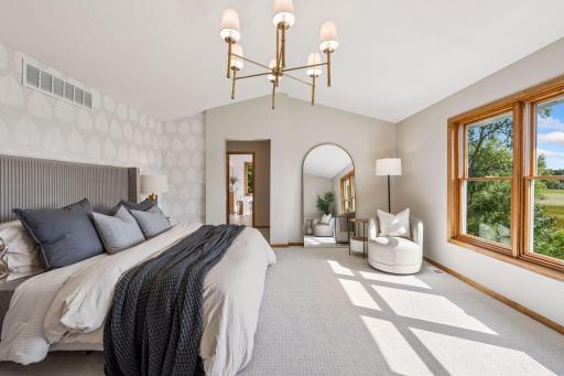 Primary suite with space for a king sized bed plus a quiet place for reading.