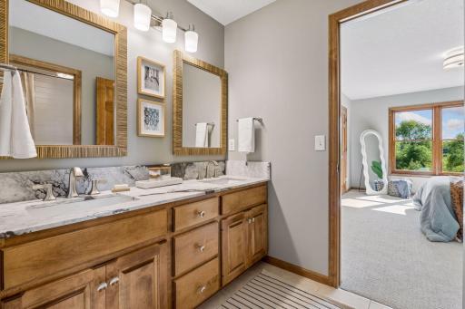 Jack and Jill bath. New double sinks, quartzite vanity top, new lighting and mirrors.