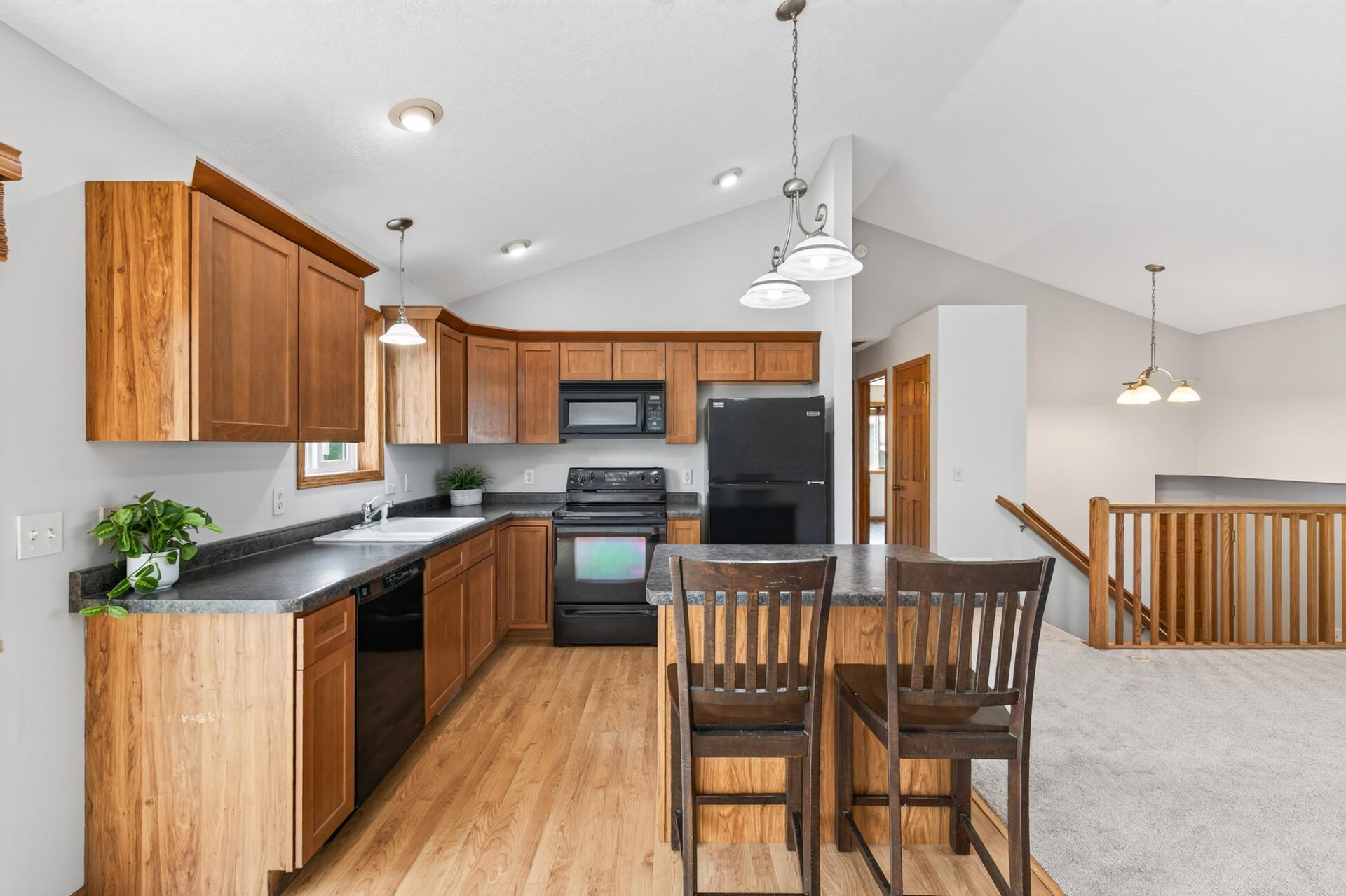 Tons of cabinet space keeps everything organized, and you will actually love doing dishes with a view of your fully fenced backyard right outside the window.
