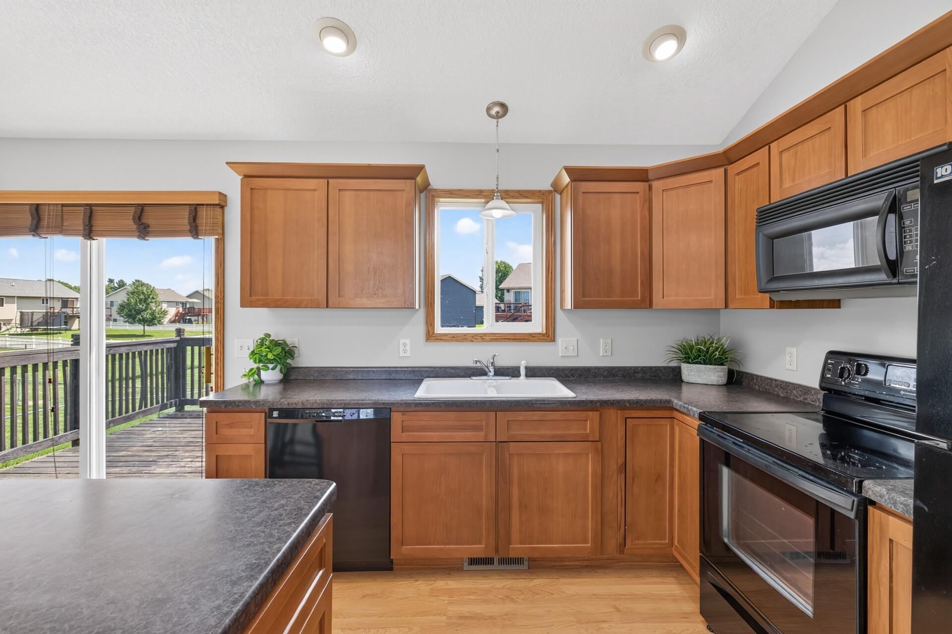 Another angle of this great kitchen reveals just how much counter top space you have to work with; plenty of room to prep, cook, and spread out for your next meal.