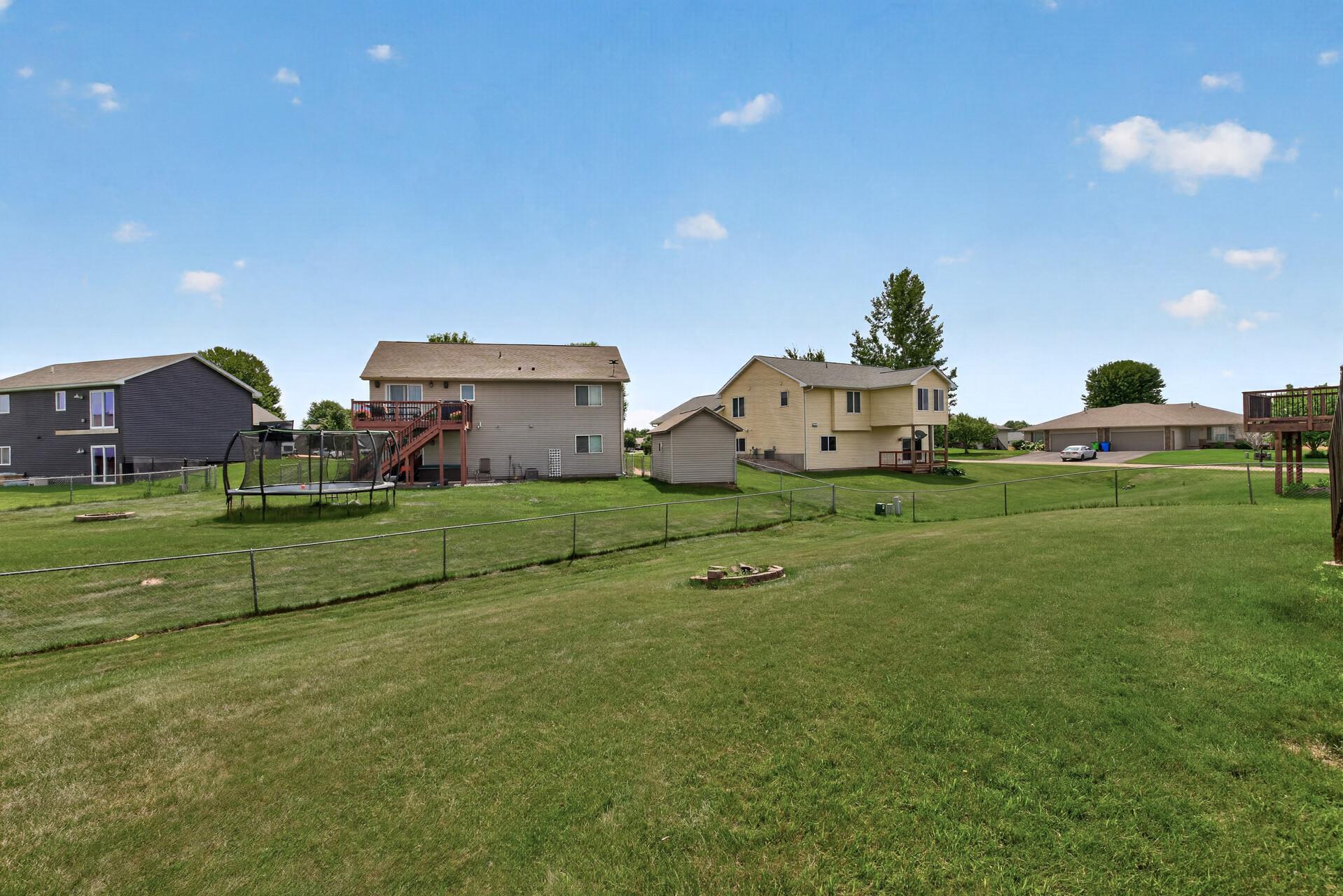 Large yard with fire pit and fully fenced!