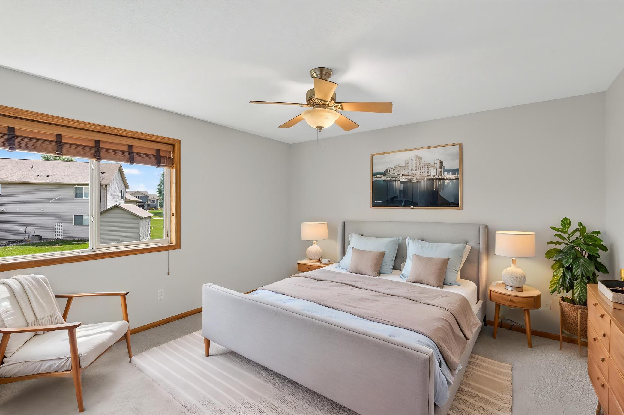The primary bedroom is a comfortable retreat complete with a walk-in closet featuring built-in racks; keeping everything organized and within reach.