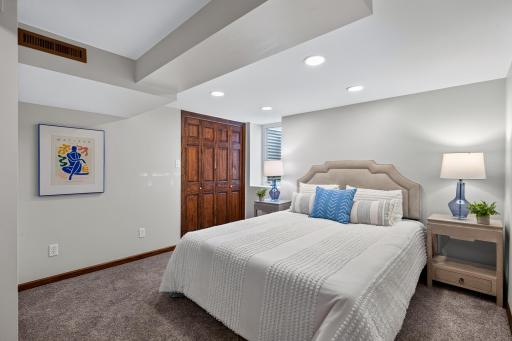 Lower-level third bedroom offers flexible space for guests, work, or hobbies.