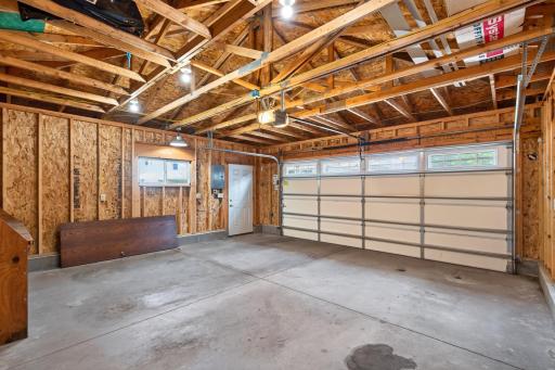 Oversized detached two-car garage with a 240-volt outlet ready for EV charging.