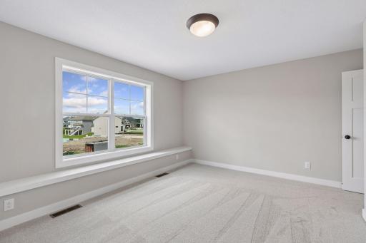 There are three additional bedrooms on the upper level.