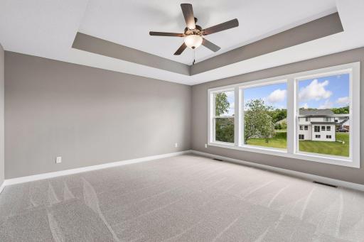 Open the grand French doors into your very own owner's suite with a private bath.