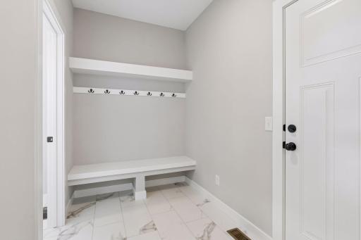 The spacious mud room helps your home stay organized.