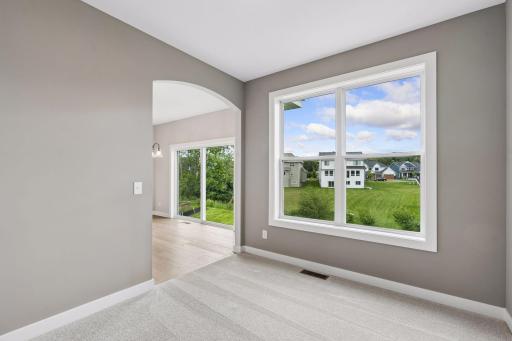 Just off the kitchen is the sun room. Use it as a reading nook or a place for your kids to play.