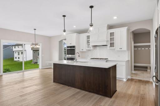 Our gourmet kitchen defines how the WOW comes standard. With a huge center island, granite countertops, gas cook top, and double ovens, plus so much more!