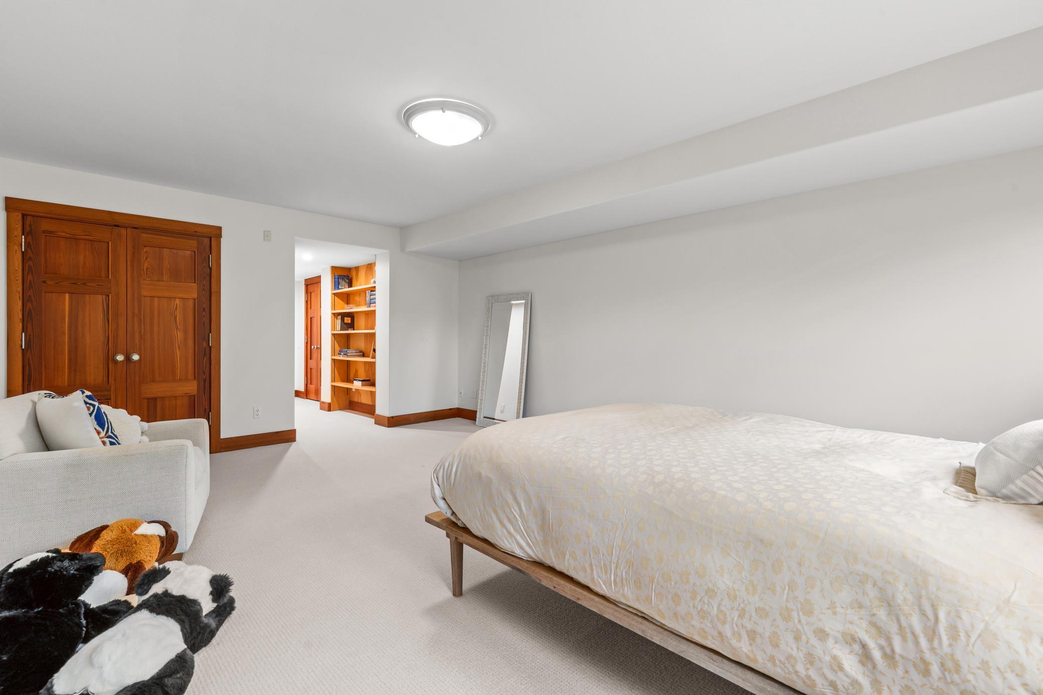 Lower level fourth bedroom with ensuite bathroom