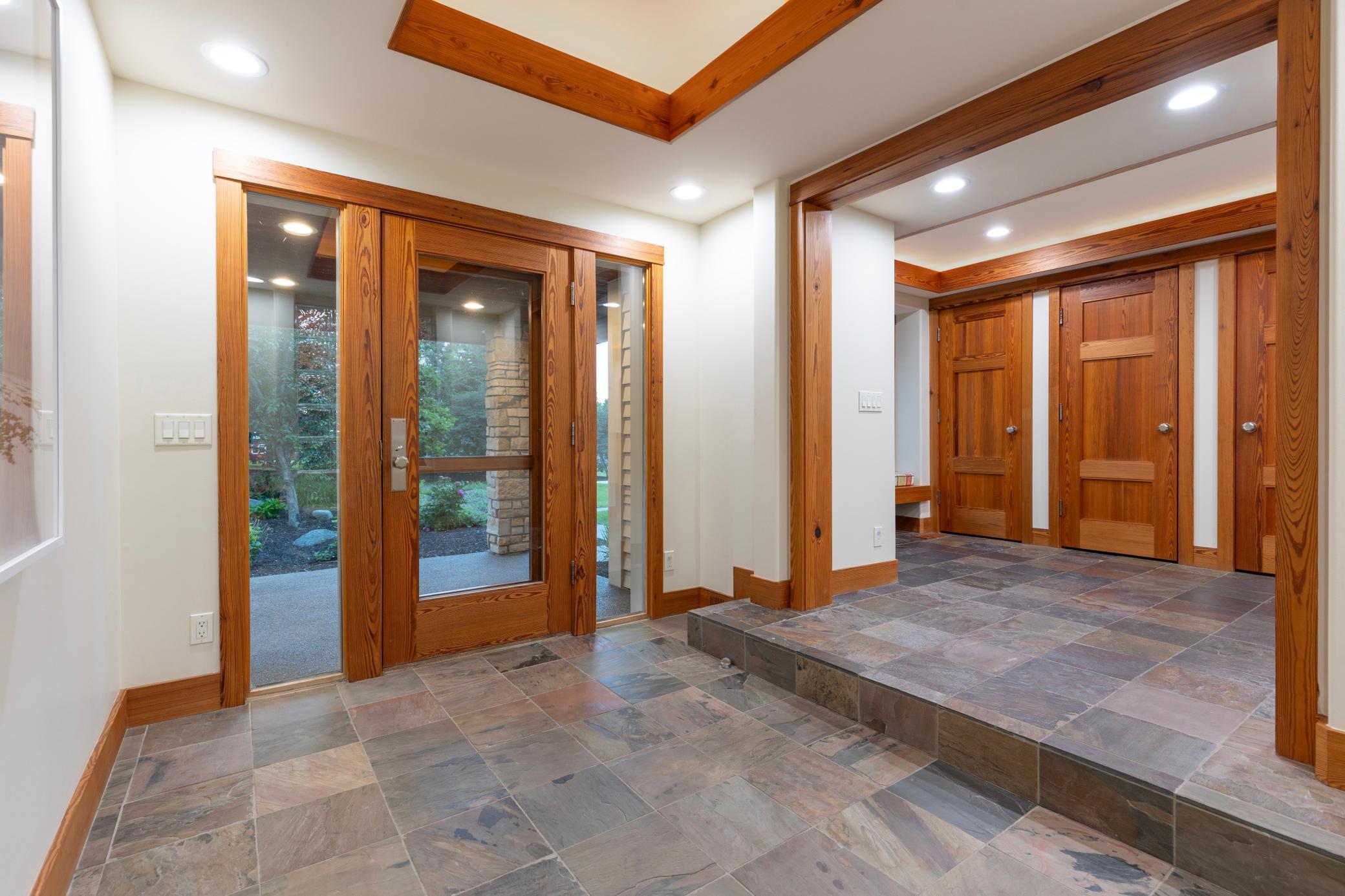 Back hall entrance with slate flooring and purposeful spaces