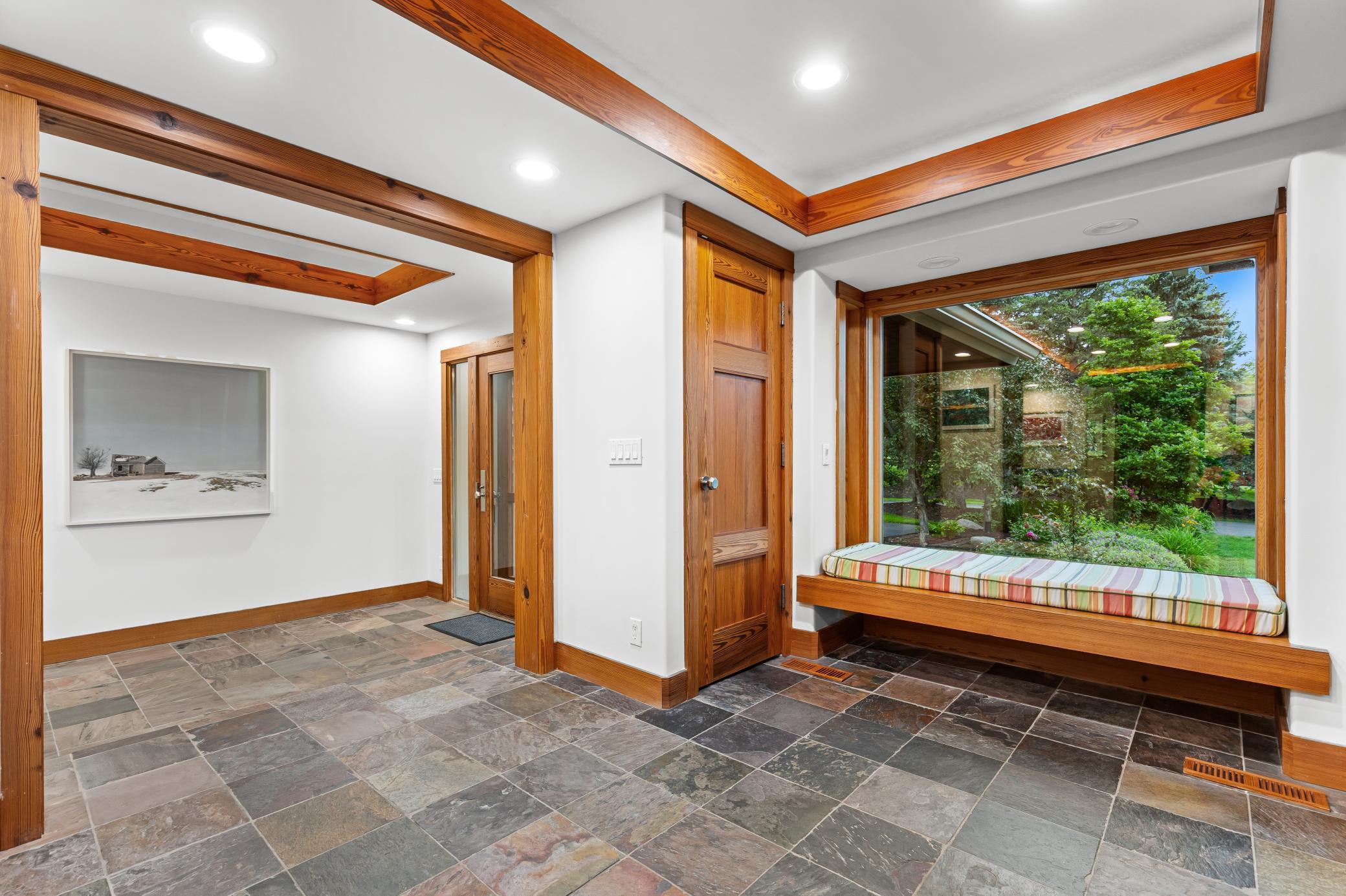 Transition areas in the back hallways with substantial closets and storage for seasonal needs