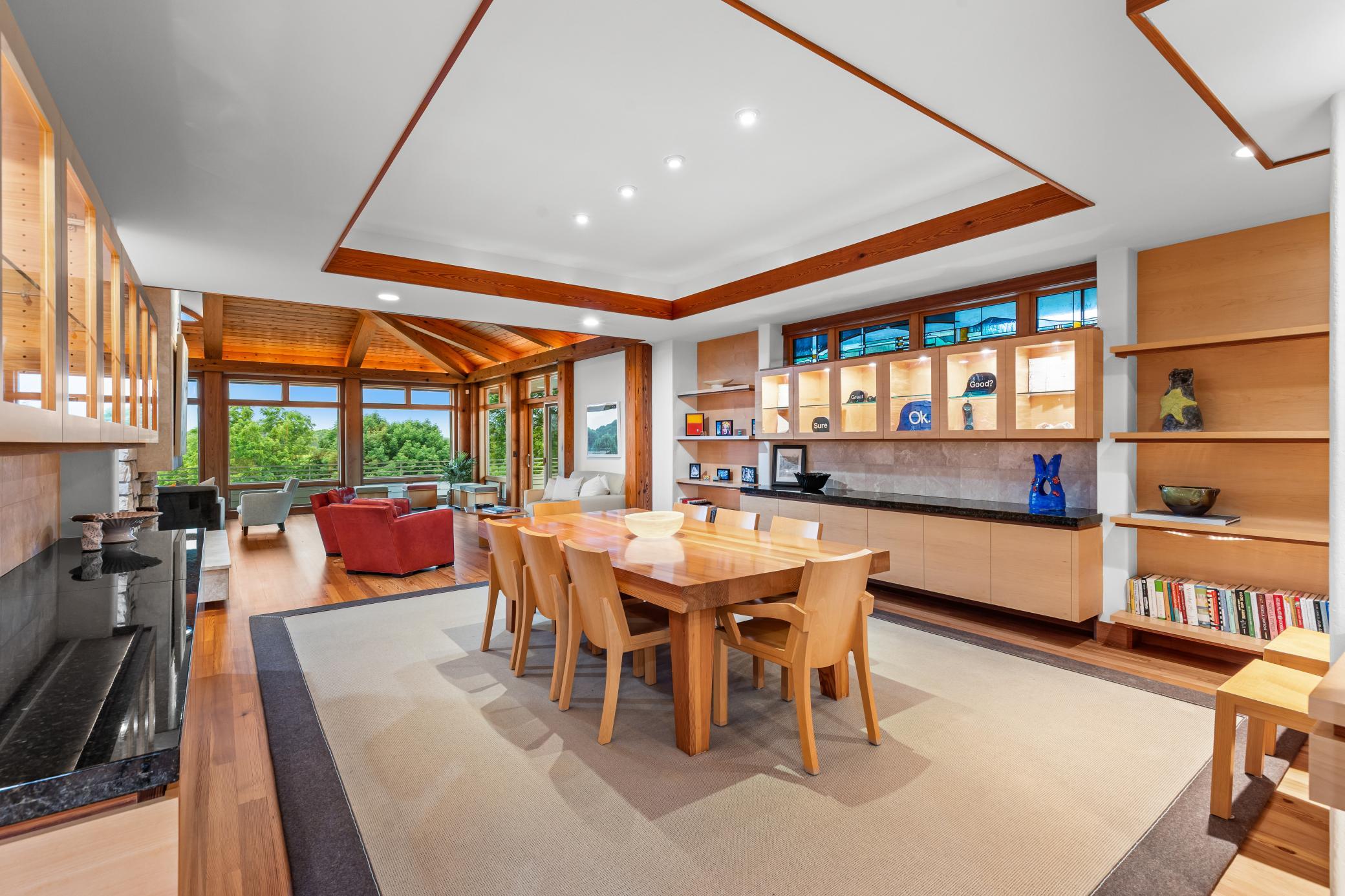 Formal dining is surrounded by cabinetry for serving, storing, displaying of art, and most importantly gathering of loved ones