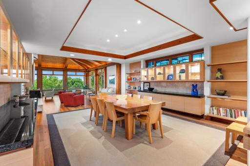 Formal dining is surrounded by cabinetry for serving, storing, displaying of art, and most importantly gathering of loved ones