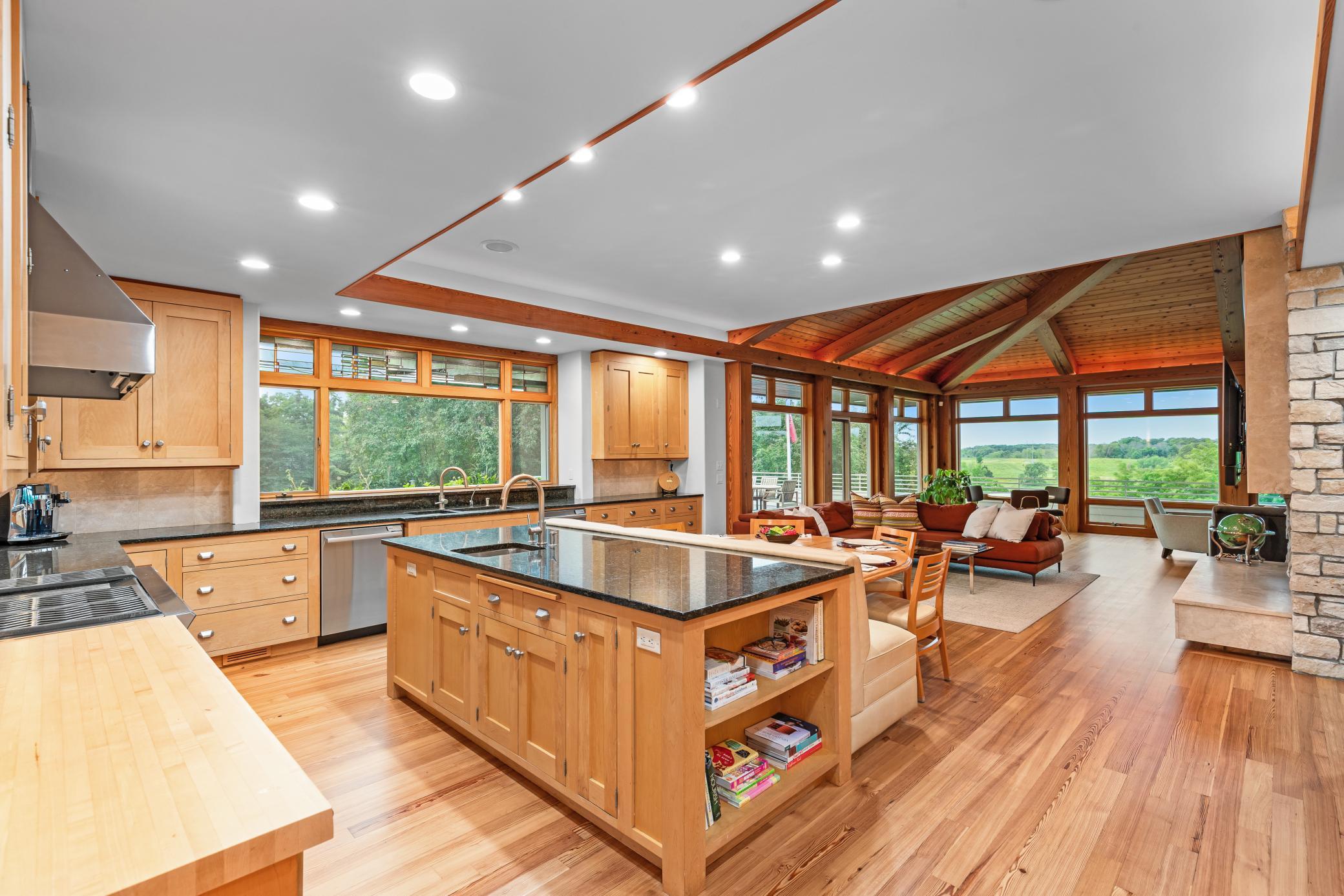 Dramatic and open - chef's kitchen has southern and forever western views