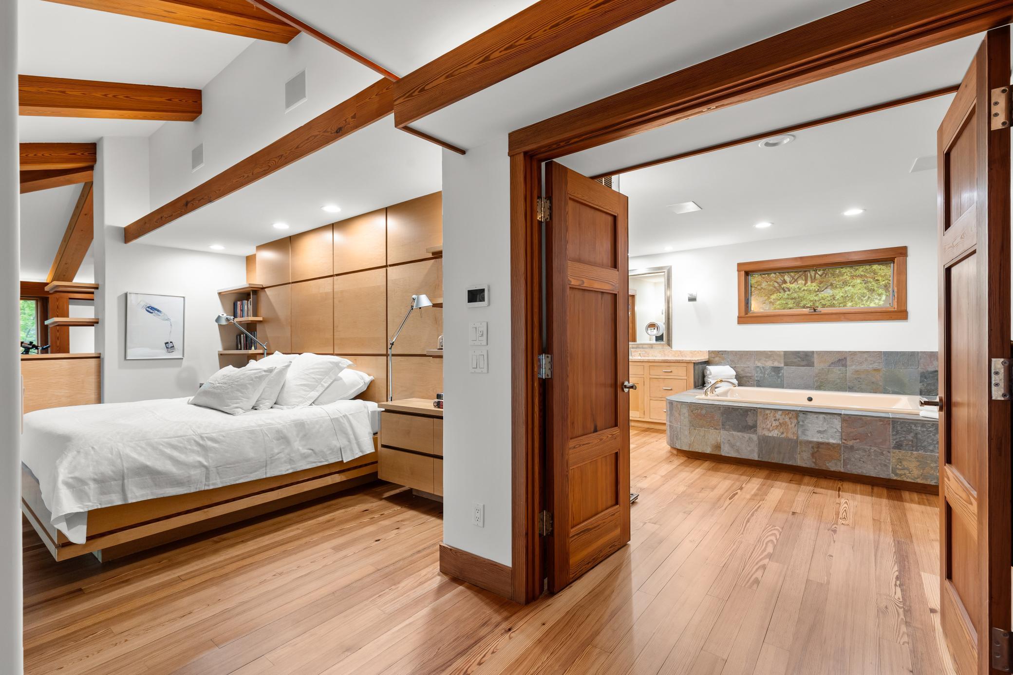 Primary bedroom with ensuite spa like bathroom spaces