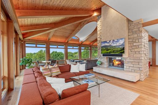 Chilton wall and limestone fireplace adds balance and depth complimented by walls of windows