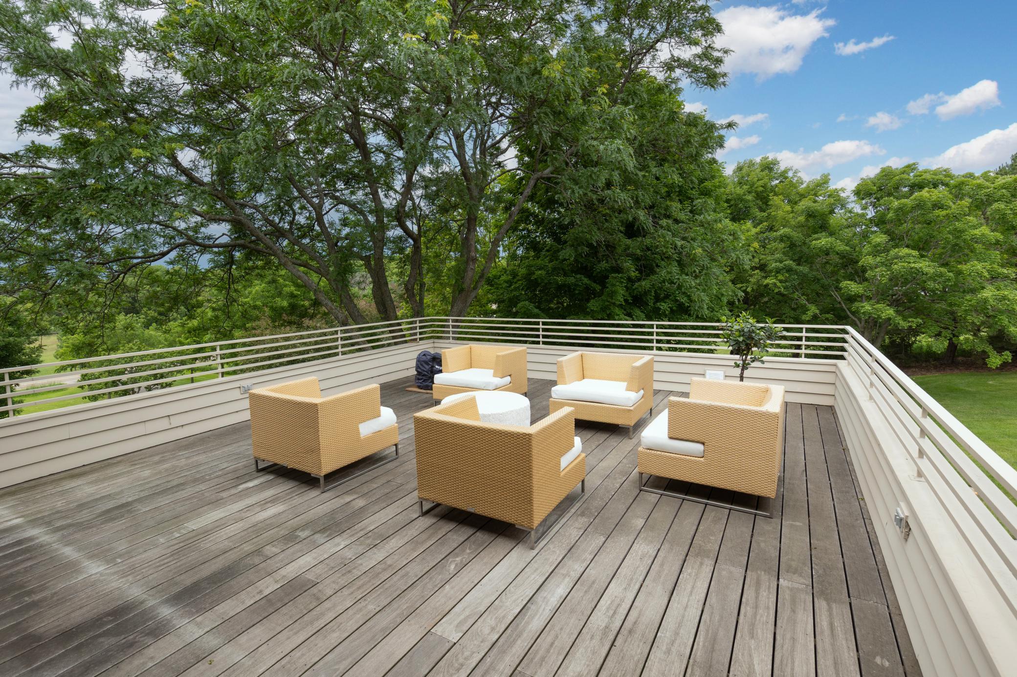 Charles Stinson designed and Frank Lloyd Wright inspired - another cantilevered ironwood deck extends generously sized with unobstructed views