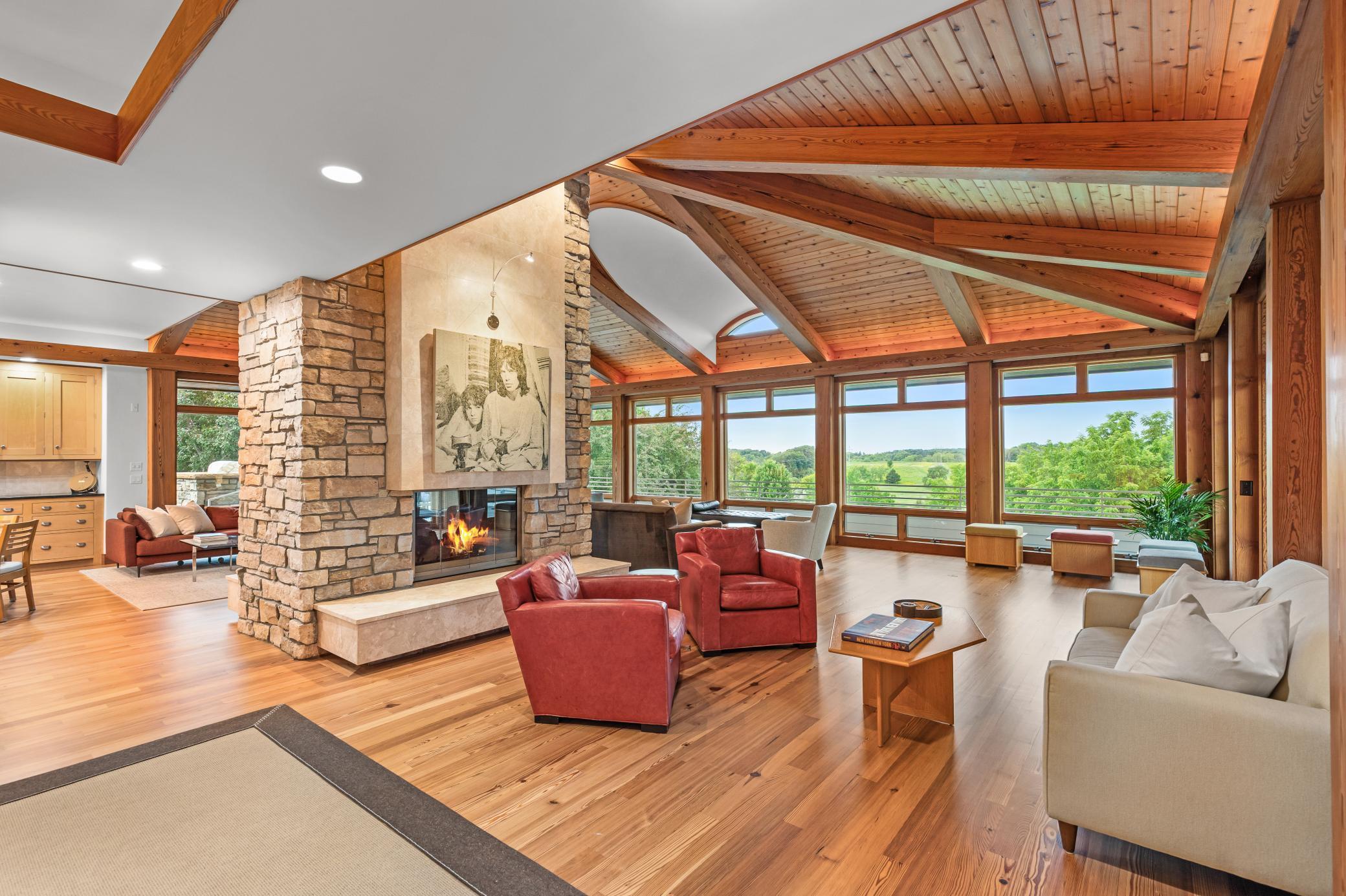 Double faced chilton and limestone fireplace gives warmth and purpose to these generous spaces