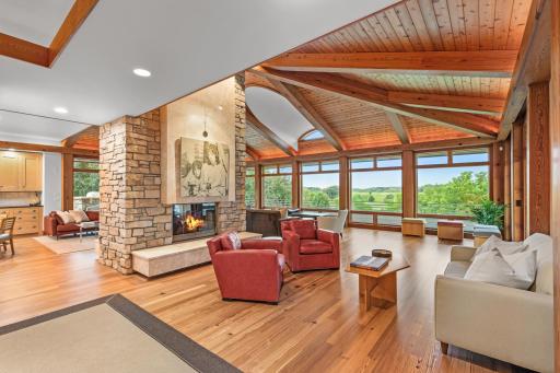 Double faced chilton and limestone fireplace gives warmth and purpose to these generous spaces