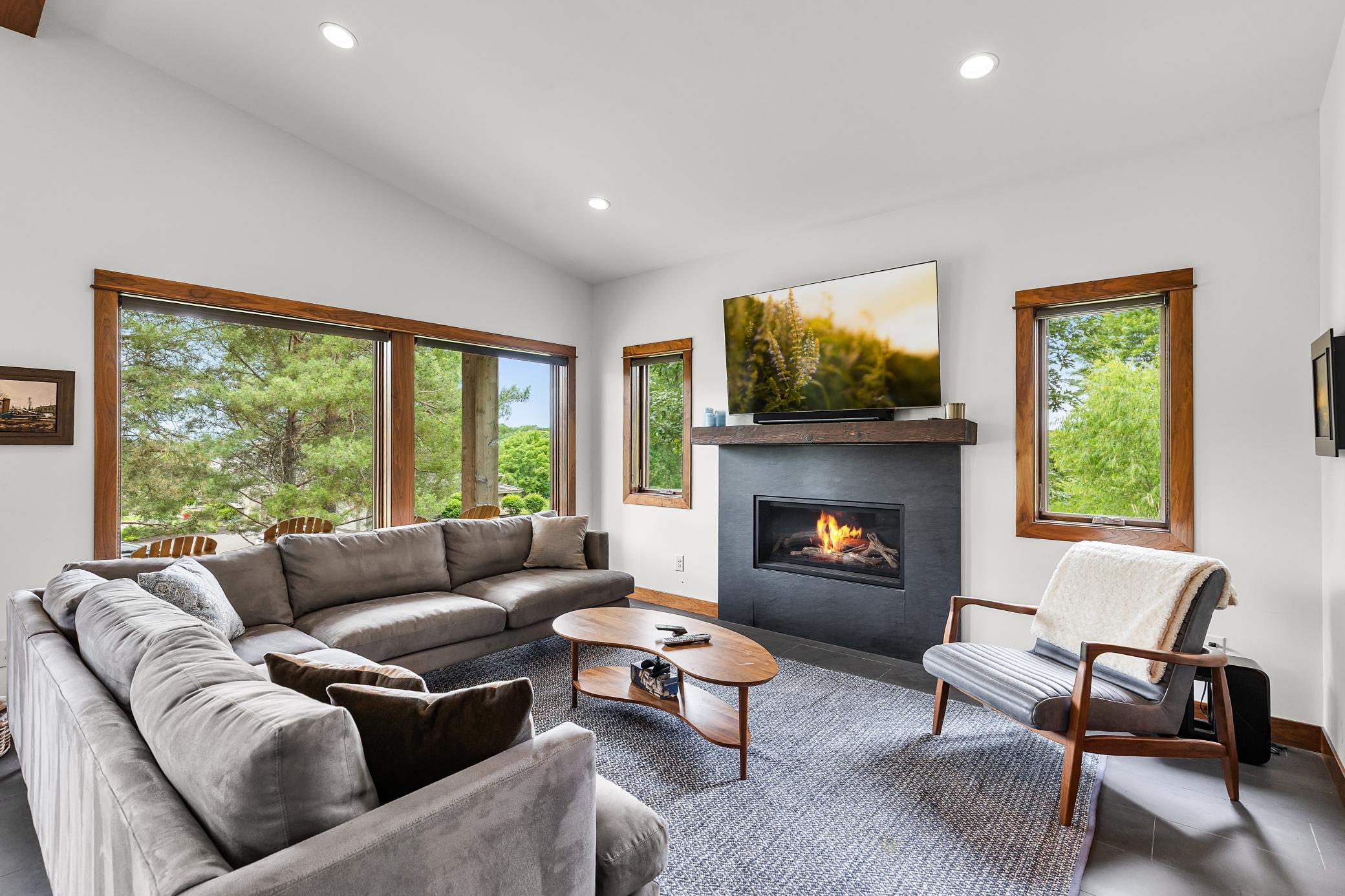 Living room space with fireplace and views of the acreage