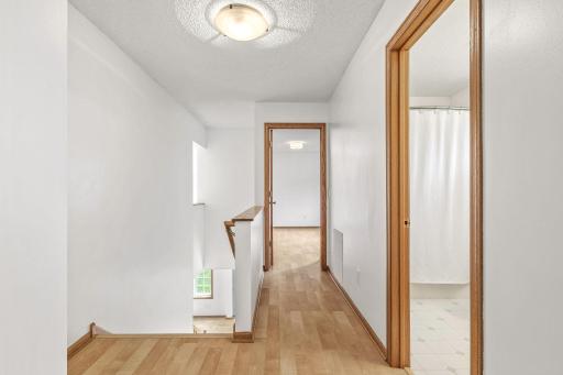 Outstanding upper level landing complete with a hall linen closet, two spacious bedrooms and a full bath