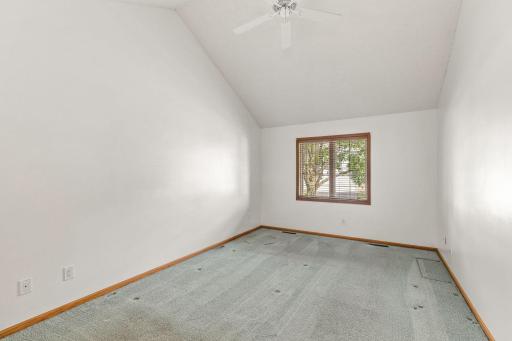 Gorgeous main level primary suite with a dramatic ceiling height and grand wall space for your furniture and artwork.