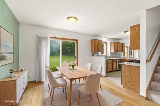 Virtually staged formal dining area to give scale to the dining room and ideas for furniture placement.