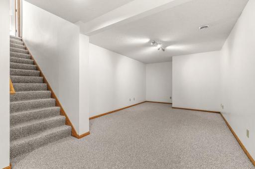 Impressive lower-level family room, perfect for casual entertaining and relaxation space.