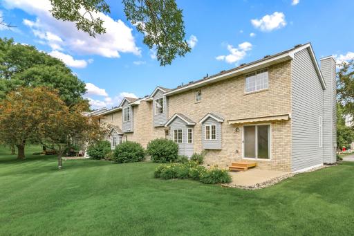 Entertain outdoors on a 12x12 concrete patio, complete with maintenance free steps and an electric retractable sun awning.