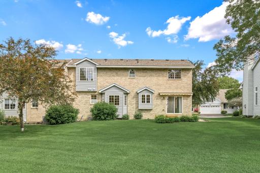 An incredible setting and high quality exterior finishes; metal siding with handsome brick accents and newer roofing (approximately 3 years) plus abundant guest parking spots positioned throughout the neighborhood.