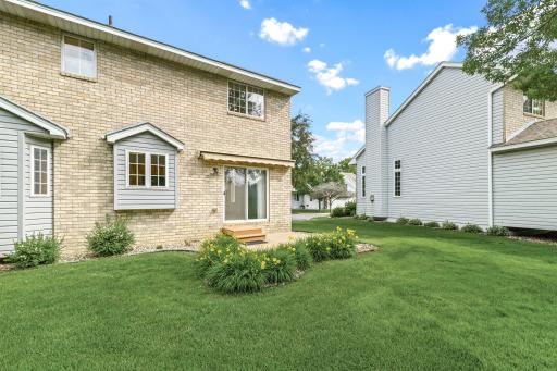 Generous spacing between homes and abundant green space lends privacy and the feeling of a single family home.