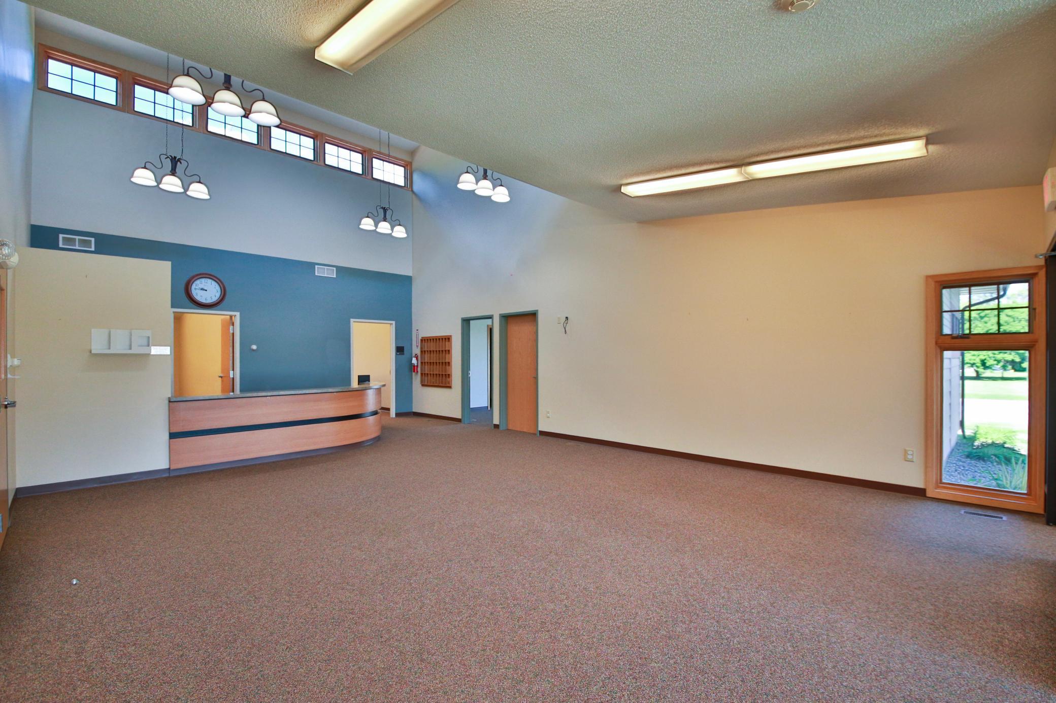 door to east side office area from main clinic reception desk