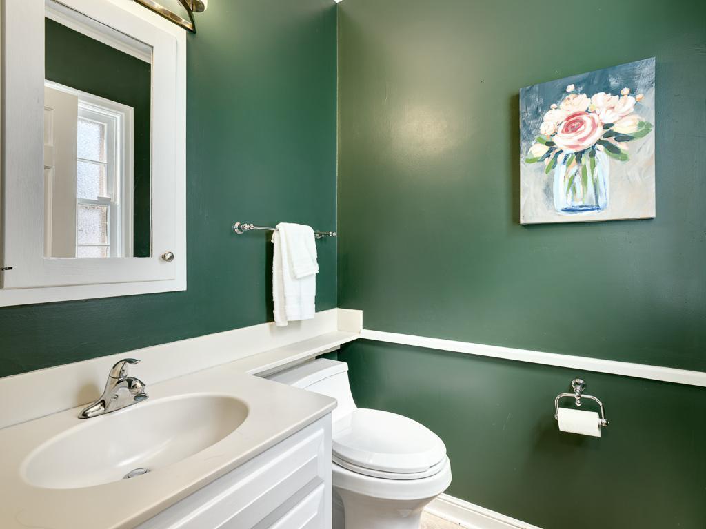 Thoughtfully placed on the main level, this powder room offers added convenience for residents and guests.