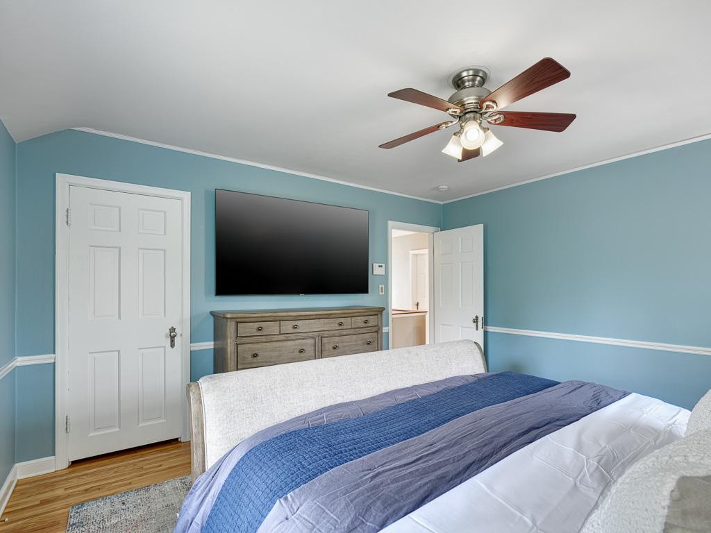 Sun-filled primary bedroom provides a serene retreat with plenty of natural light.