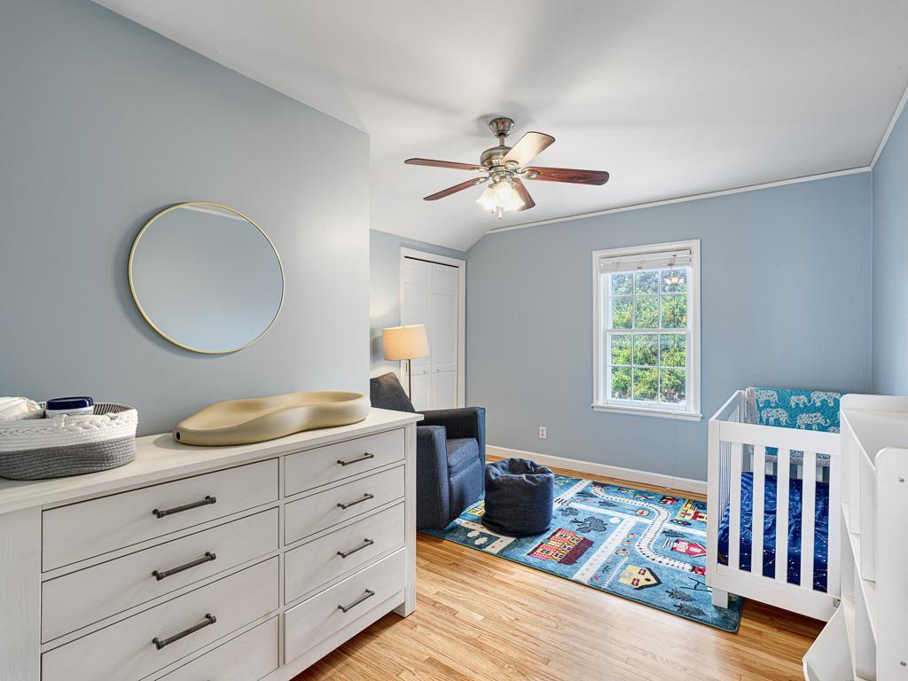 Third and fourth bedroom showcasing stunning wood floors that add warmth and timeless character.