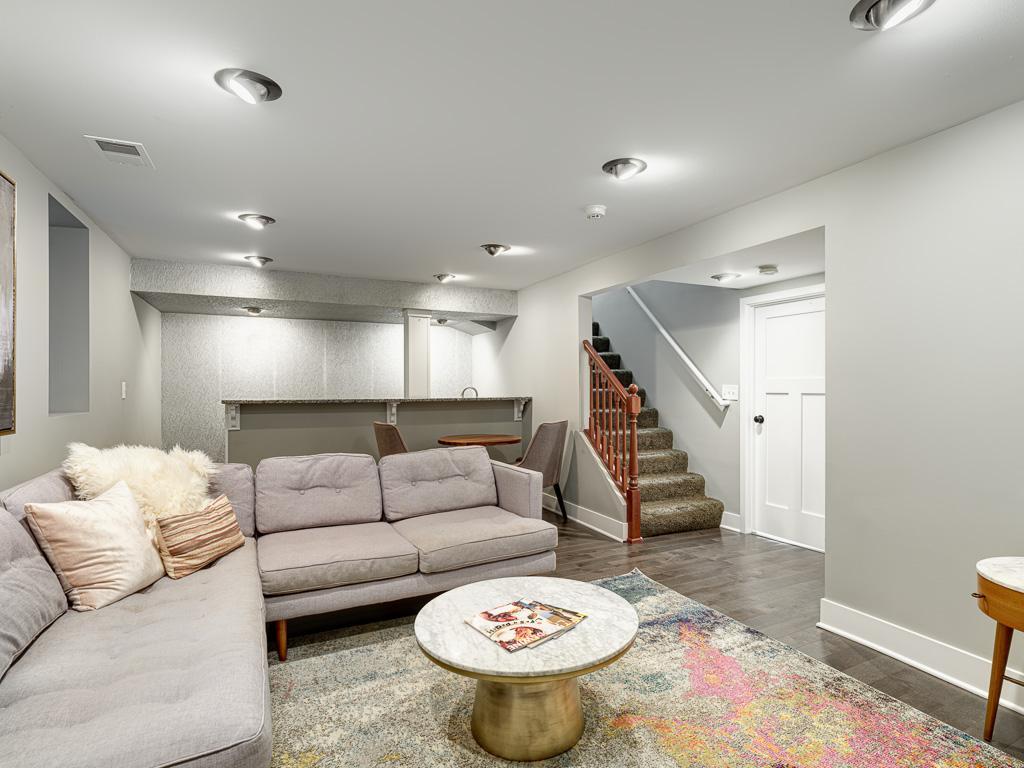 Finished lower-level family room provides valuable additional living space for relaxing, entertaining, or gathering.