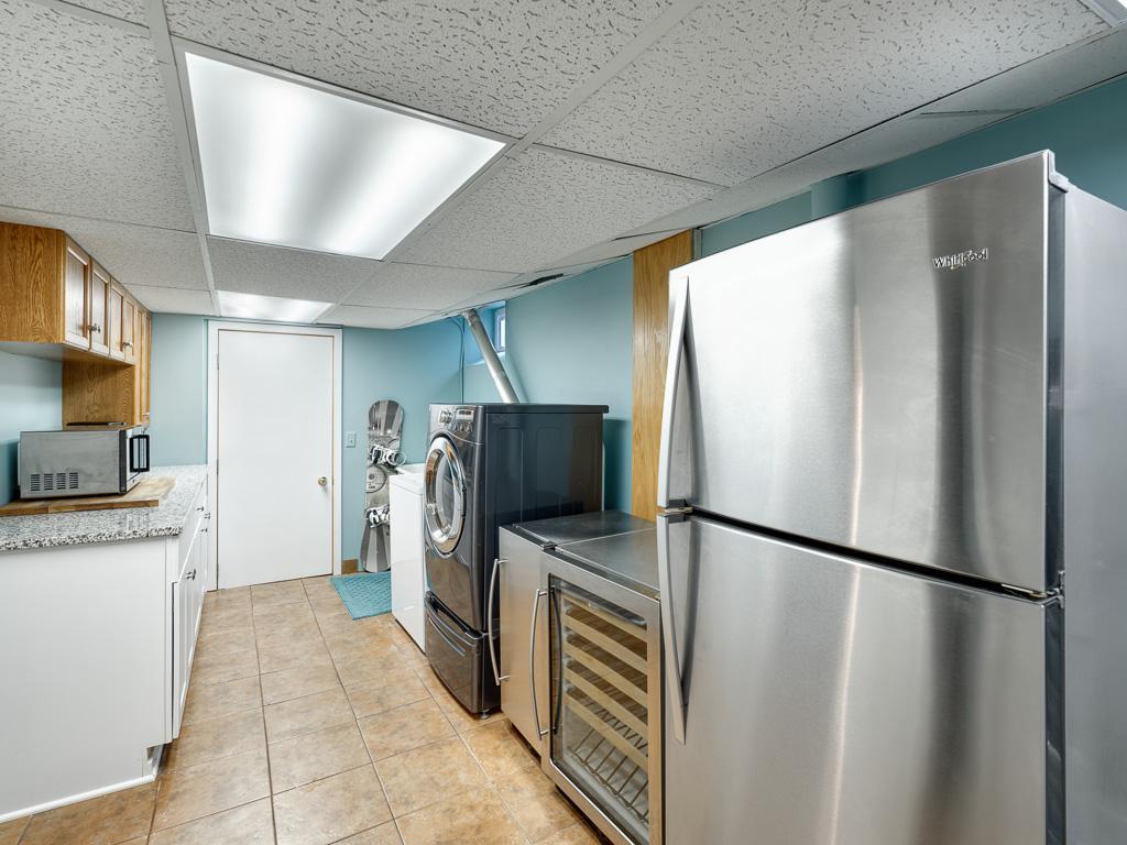 Convenient lower level laundry room also provides valuable additional storage space.