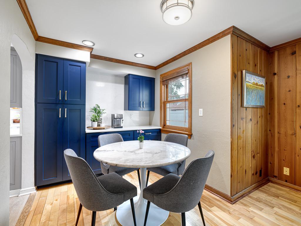 Thoughtfully designed built-ins near the informal dining area offer convenient storage and a dedicated space for coffee, tea, and everyday essentials.