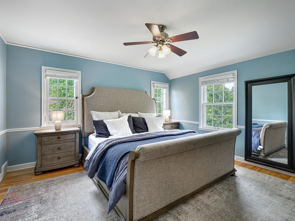 The upper level features four bedrooms together, providing a functional and family-friendly layout.