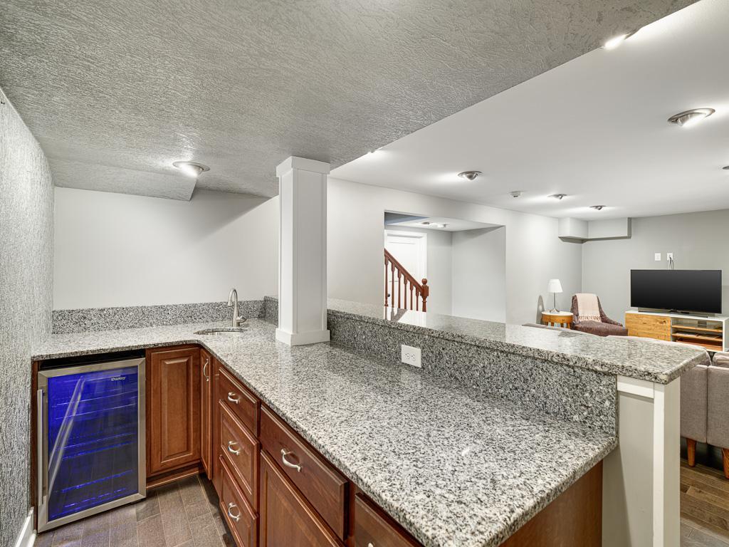 A convenient wet bar adds functionality and makes entertaining effortless.