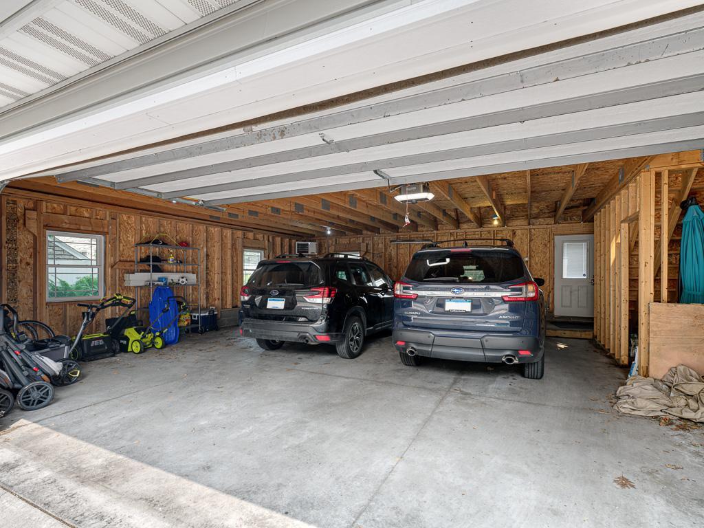 The spacious garage provides exceptional storage capacity with plenty of room for vehicles, hobbies, and more.