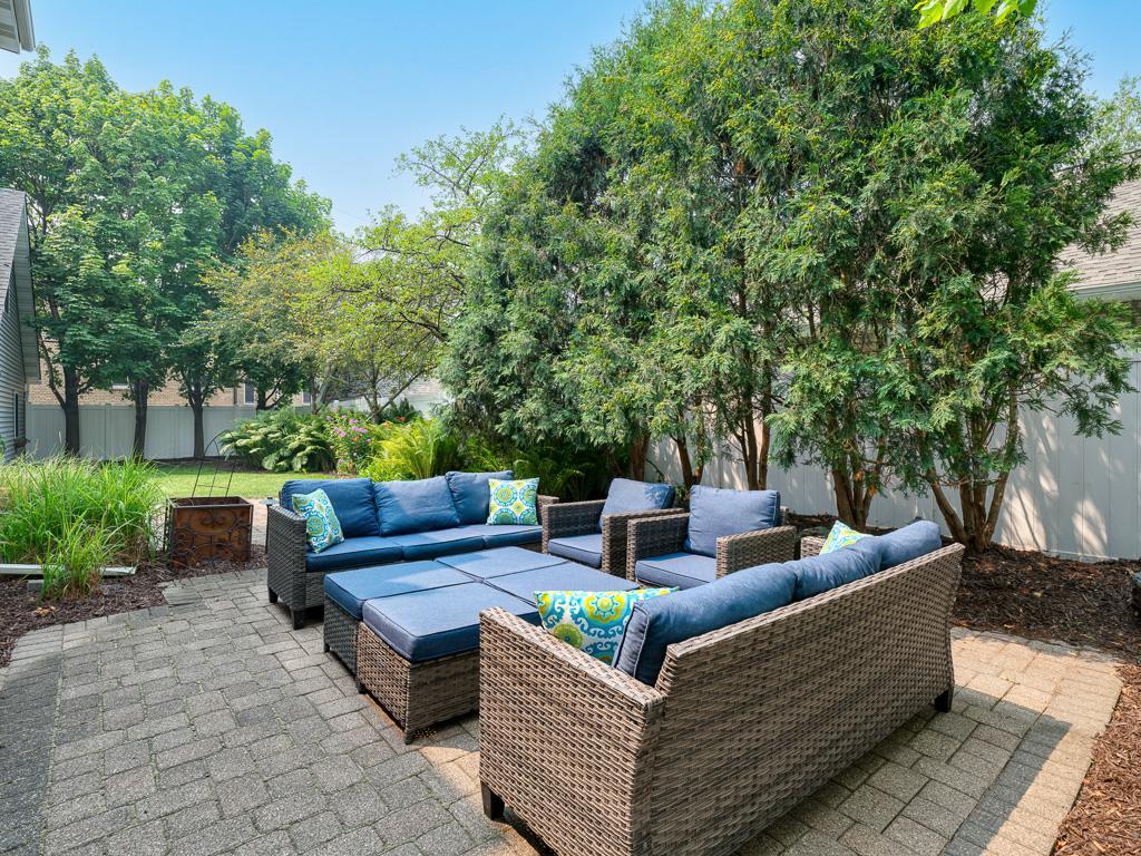 Expansive paver patio off the dining room creates an effortless connection between indoor and outdoor living.