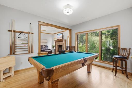 Main floor flex room currently used as a pool room