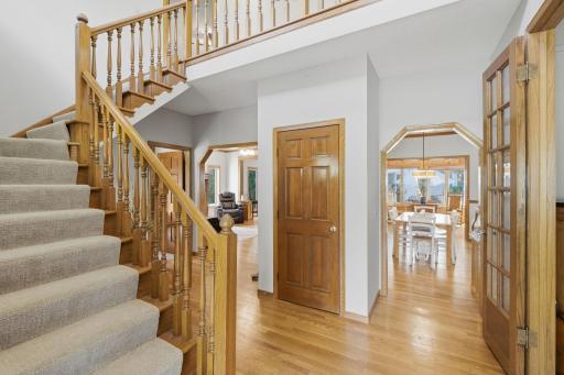 Inviting foyer with hardwood floors and open stairway