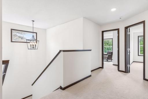 Four large bedrooms upstairs, all with ensuite baths.