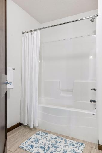 Separate room with bathtub, in the shared bath.