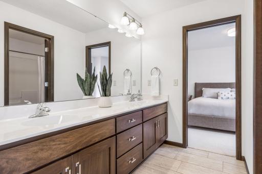 "Hollywood" style bath sits in between two bedrooms, with double vanity sink, and separate room with the bathtub and toilet, for privacy.